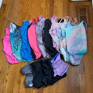 9 gymnastics leotards, worn from 7-12, good condition